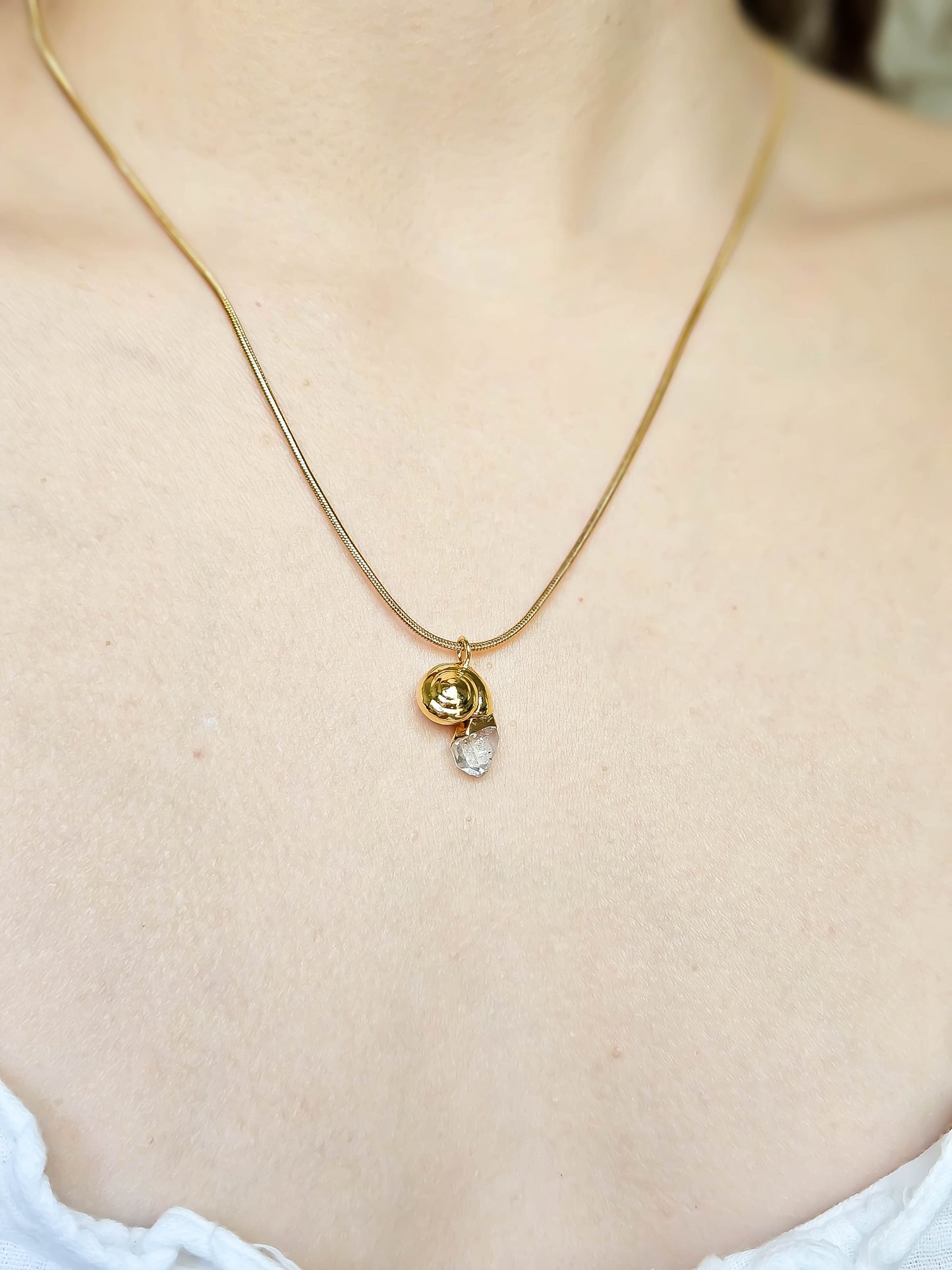 Collier coquillage, Or